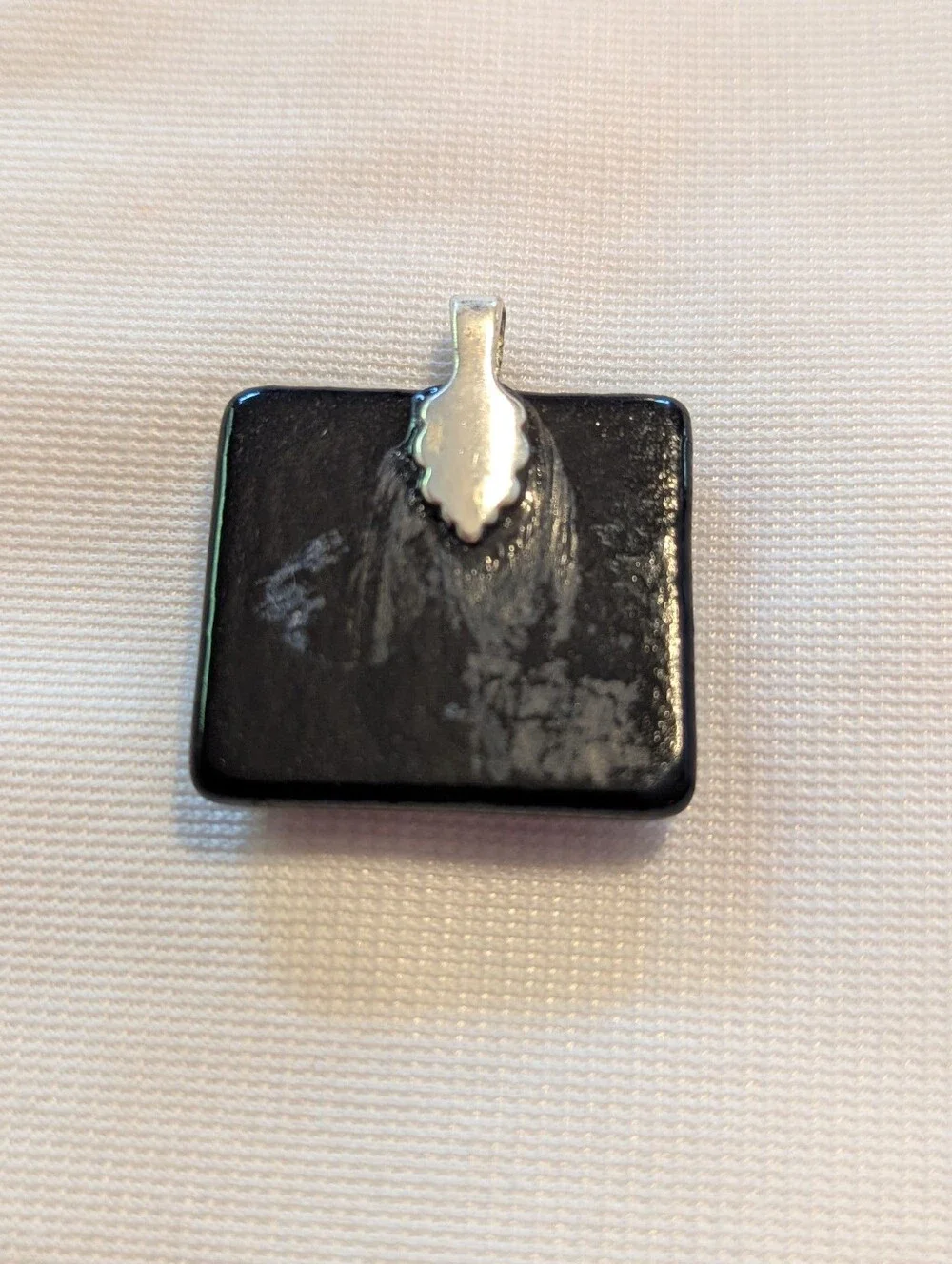 Black Pendant Featuring A Geometric Firework Pattern With Pink Center Handmade